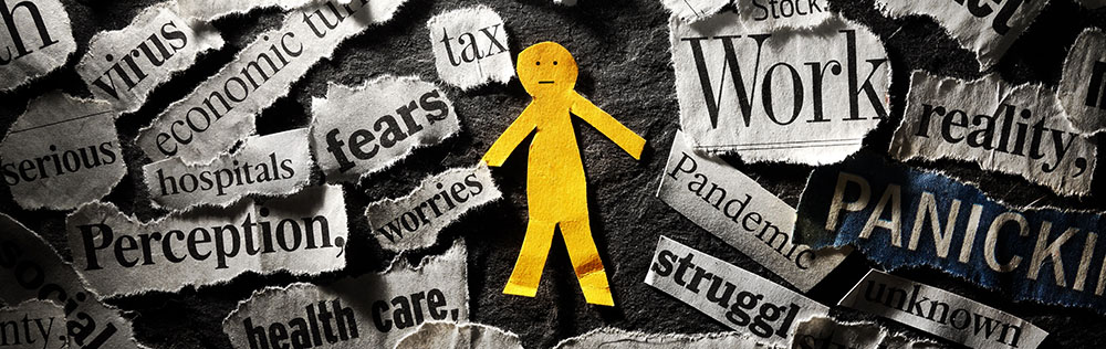 Little yellow paper person surrounded by fears and worries.