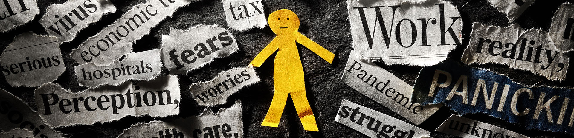 Little yellow paper person surrounded by fears and worries.
